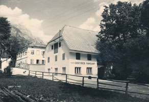 Mertnova gostilna v Logu pod Mangartom je leta 1949 dobila status zakupne gostilne in se preimenovala v gostilno Mangart. Jožef Černuta je ostal lastnik nepremičnine in je lahko še naprej razmeroma samostojno posloval. Vključen je bil v plansko preskrbo prostih viškov, poleg tega je smel kupovati tudi izven državne preskrbovalne mreže, le vso gostinsko opremo je moral za majhen znesek prodati Poverjeništvu za gostinstvo in turizem Tolmin. (Arhiv PANG)