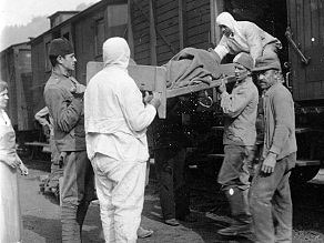 Loading wounded soldiers on to special cars adapted for carrying the wounded. Loading wounded soldiers on to special cars adapted for carrying the wounded.